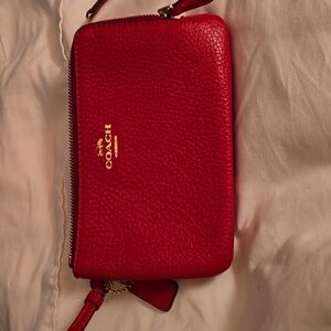 Coach pink zipper round double wristelet.